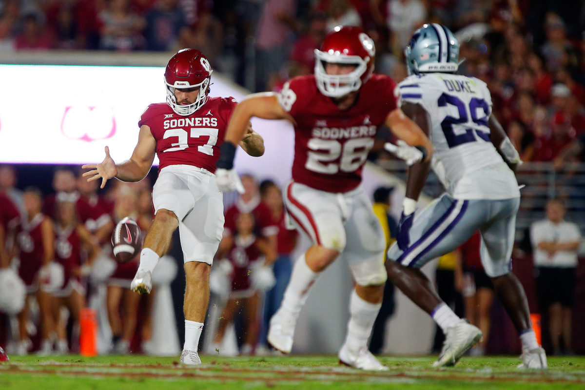 Michael Turk punts the ball for the Oklahoma Sooners.