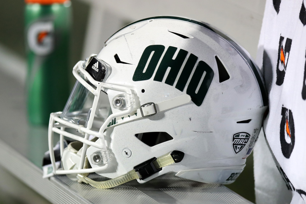 An Ohio Bobcats helmet sits on the sideline during a game against Akron.