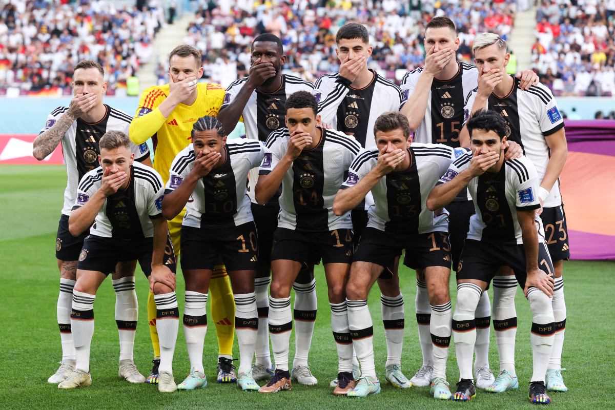 Germany players cover their mouths in protest before a match in World Cup 2022 in Qatar.