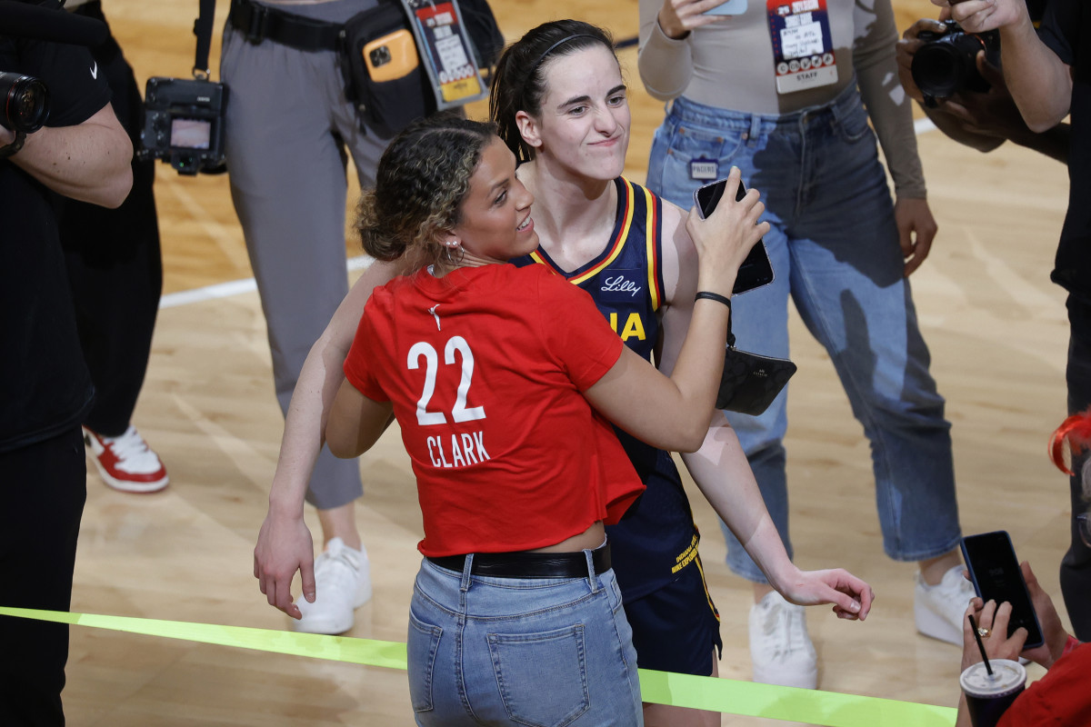 INDIANAPOLIS, IN - MAY 09: Indiana Fever guard Caitlin Clark (22) hugs her former Iowa Hawkeyes teammate Gabbie Marshall after playing against the Atlanta Dream during a WNBA preseason game on May 9, 2024, at Gainbridge Fieldhouse in Indianapolis, Indiana. (Photo by Brian Spurlock/Icon Sportswire via Getty Images)