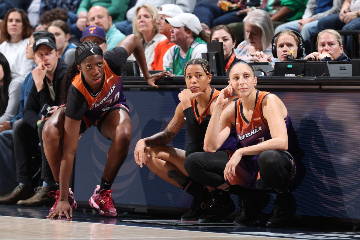 MINNEAPOLIS, MN - MAY 31: Charisma Osborne #20, Natasha Cloud #0, Diana Taurasi #3 of the Phoenix Mercury look on during the game against the Minnesota Lynx on May 31, 2024 at Target Center in Minneapolis, Minnesota. NOTE TO USER: User expressly acknowledges and agrees that, by downloading and or using this Photograph, user is consenting to the terms and conditions of the Getty Images License Agreement. Mandatory Copyright Notice: Copyright 2024 NBAE (Photo by David Sherman/NBAE via Getty Images)