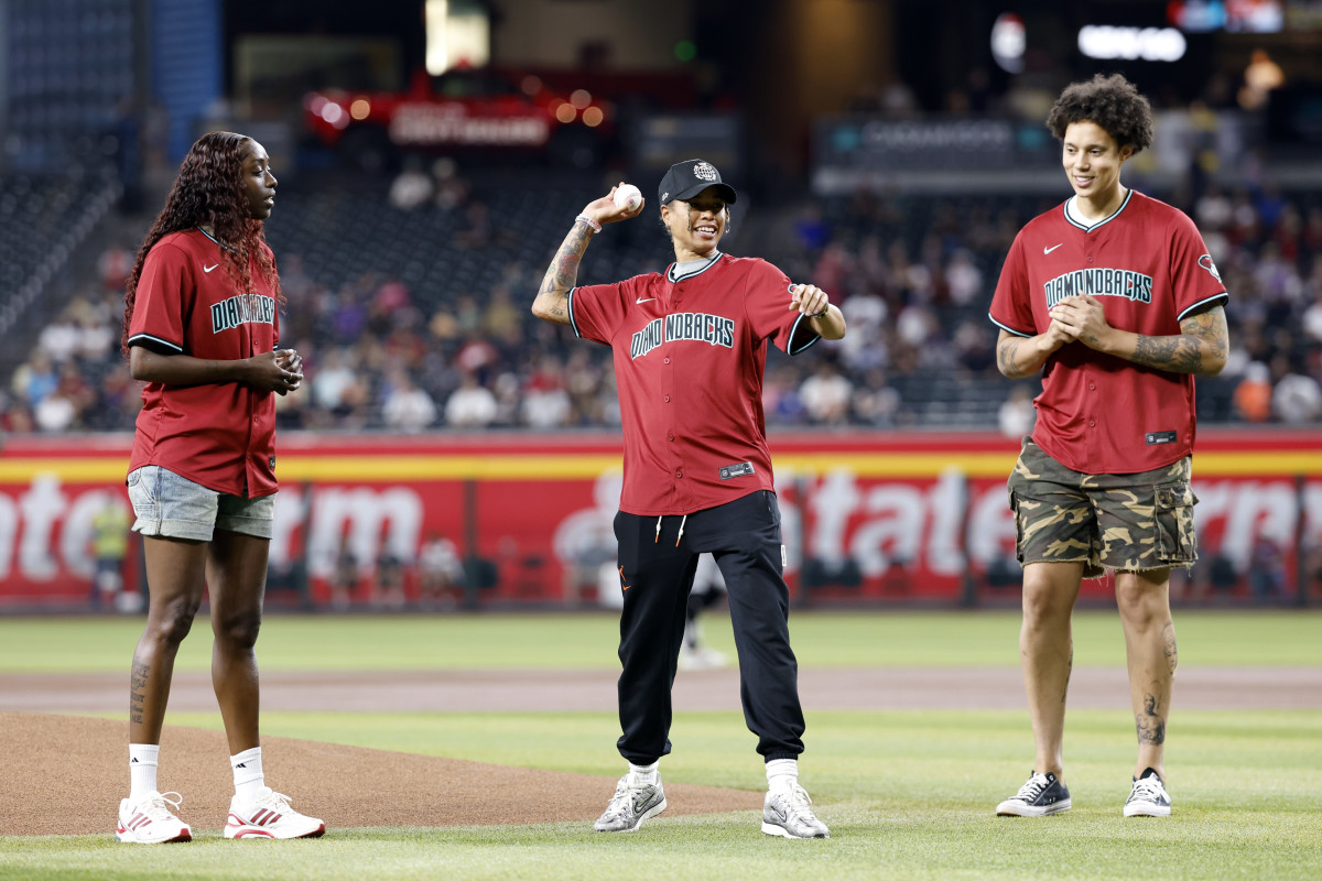 PHOENIX, ARIZONA - JUNE 14: (L-R) WNBA players Kahleah Copper, Natasha Cloud and Brittney Griner throw out the first pitch before the game between the Arizona Diamondbacks and the Chicago White Sox at Chase Field on June 14, 2024 in Phoenix, Arizona. (Photo by Chris Coduto/Getty Images)