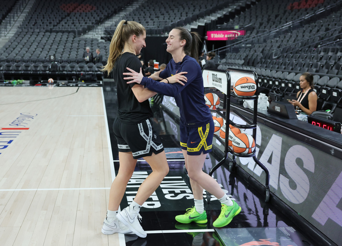 LAS VEGAS, NEVADA - JULY 02: Former Iowa Hawkeyes teammates Kate Martin (L) #20 of the Las Vegas Aces and Caitlin Clark #22 of the Indiana Fever joke around with each other on the court during warmups before their game at T-Mobile Arena on July 02, 2024 in Las Vegas, Nevada. NOTE TO USER: User expressly acknowledges and agrees that, by downloading and or using this photograph, User is consenting to the terms and conditions of the Getty Images License Agreement. (Photo by Ethan Miller/Getty Images)