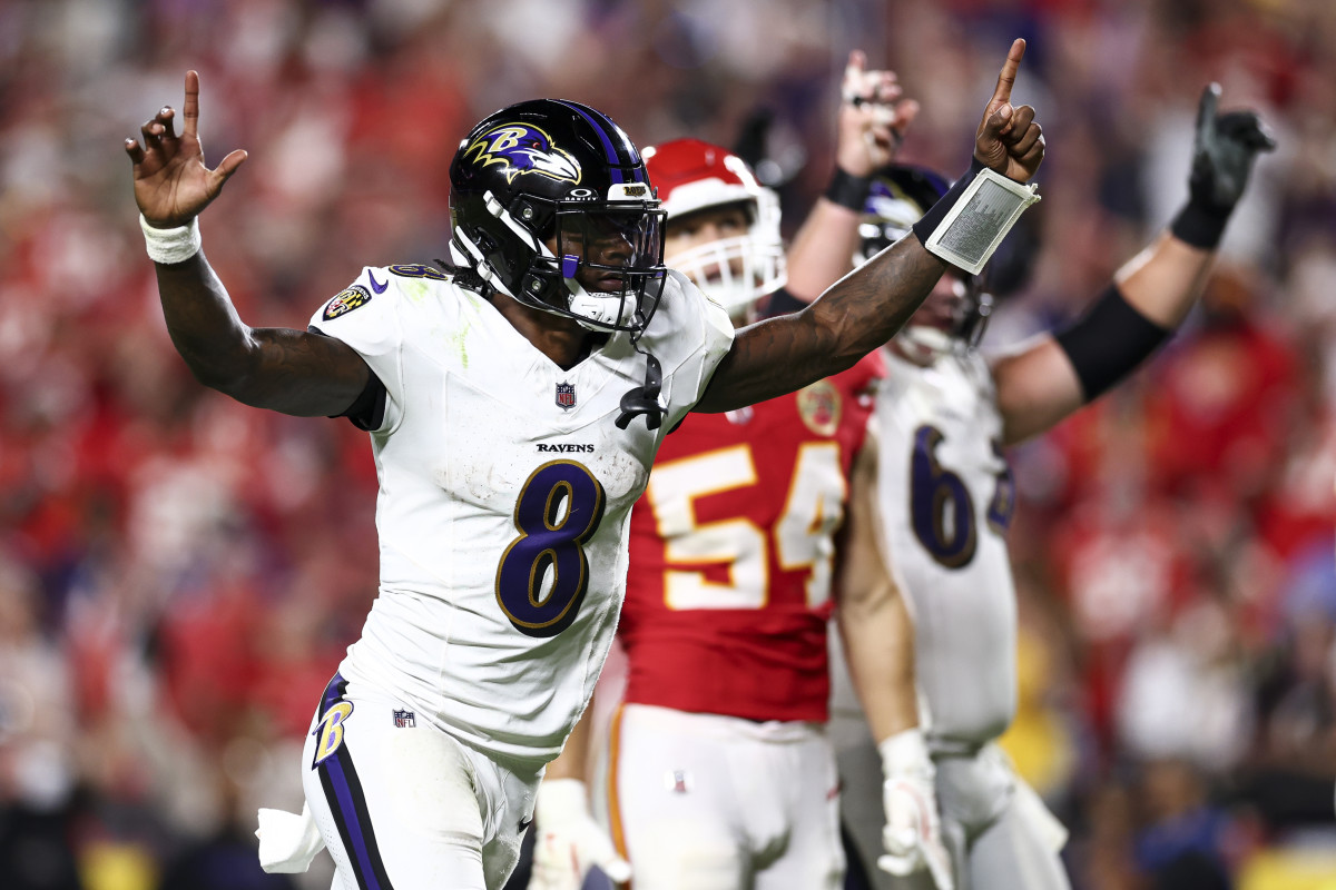 Lamar Jackson celebrates on the field.