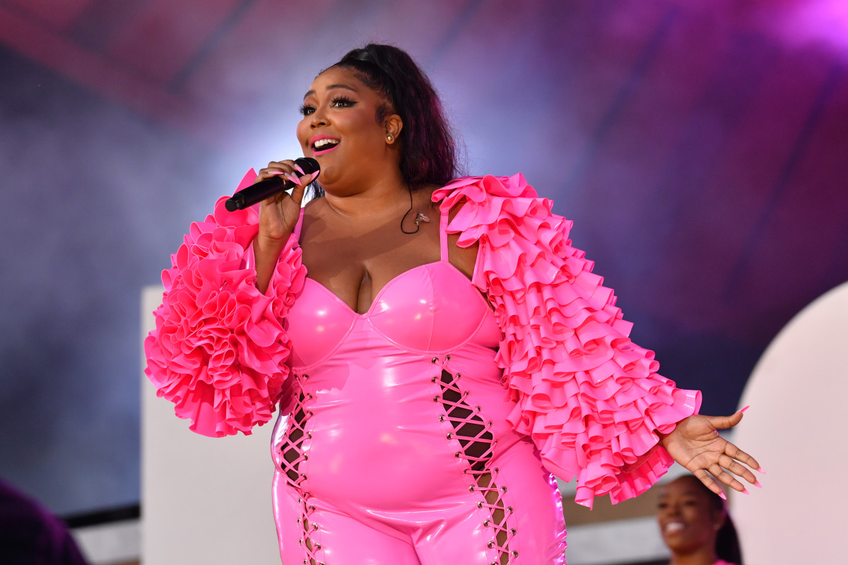 Lizzo pours into a skimpy American Football inspired mini dress as she  enjoys the Super Bowl