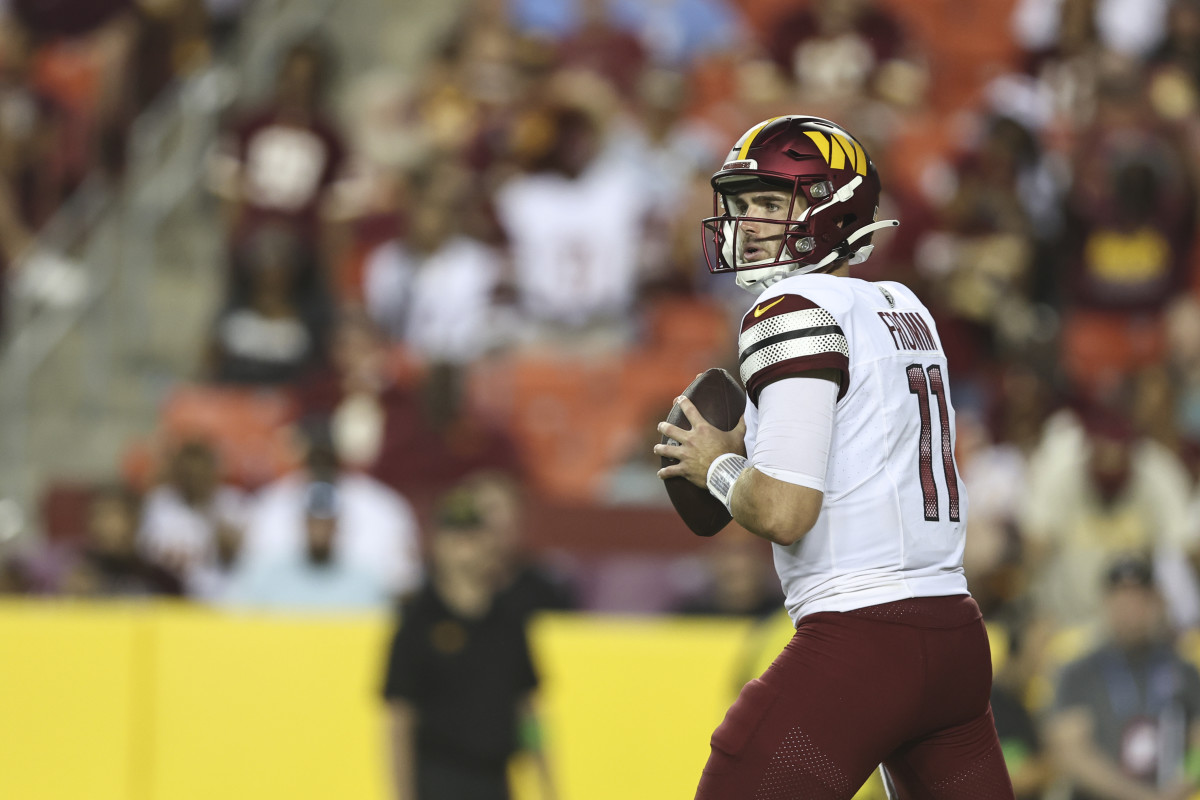 Washington Commanders quarterback Jake Fromm (11) looking down field to  throw the ball against the Cincinnati Bengals during the first half of an  NFL preseason football game, Saturday, Aug. 26, 2023, in