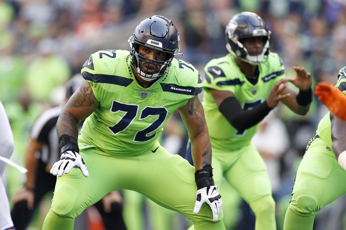 Seattle Seahawks tackle Abraham Lucas (72) walks on the field