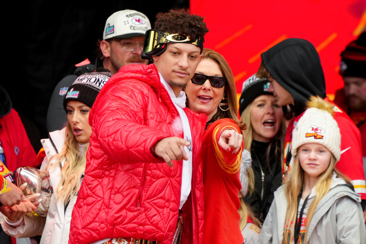 KANSAS CITY, MISSOURI - FEBRUARY 15: Patrick Mahomes #15 of the Kansas City Chiefs and mother Randi Mahomes celebrate on stage during the Kansas City Chiefs Super Bowl LVII victory parade on February 15, 2023 in Kansas City, Missouri. (Photo by Jay Biggerstaff/Getty Images)