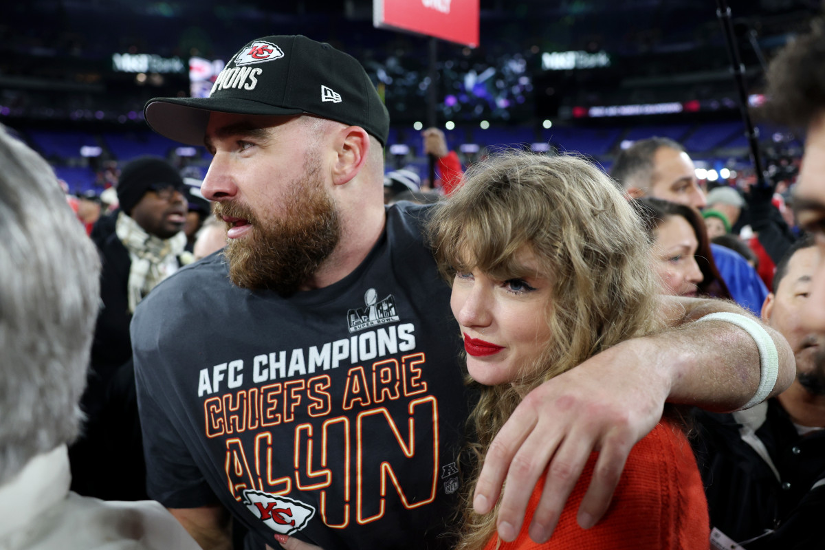 Taylor Swift celebrates with Travis Kelce.