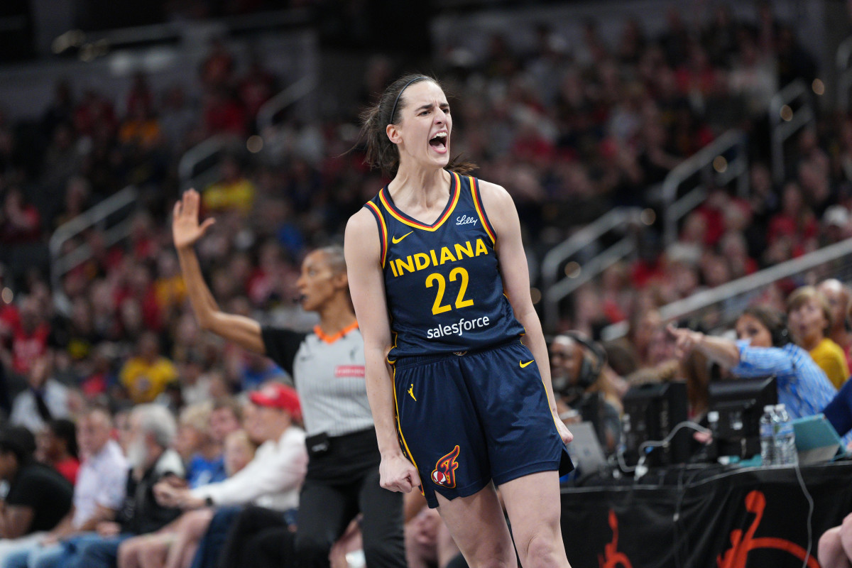 Caitlin Clark celebrates a made basket.