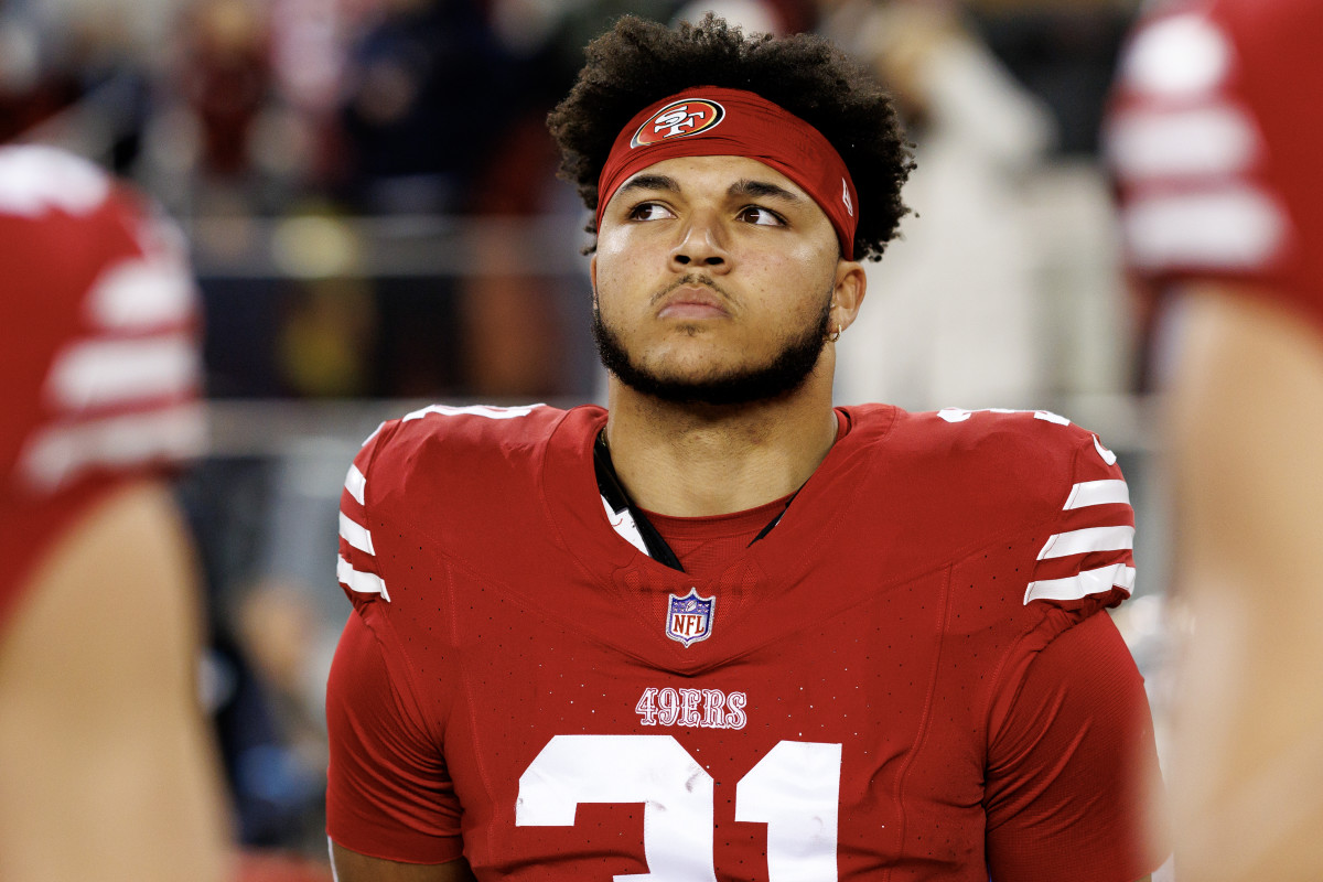 SANTA CLARA, CALIFORNIA - DECEMBER 12: Running back Isaac Guerendo #31 of the San Francisco 49ers stands on the sidelines during the national anthem prior to an NFL football game against the Los Angeles Rams, at Levi's Stadium on December 12, 2024 in Santa Clara, California. (Photo by Brooke Sutton/Getty Images)