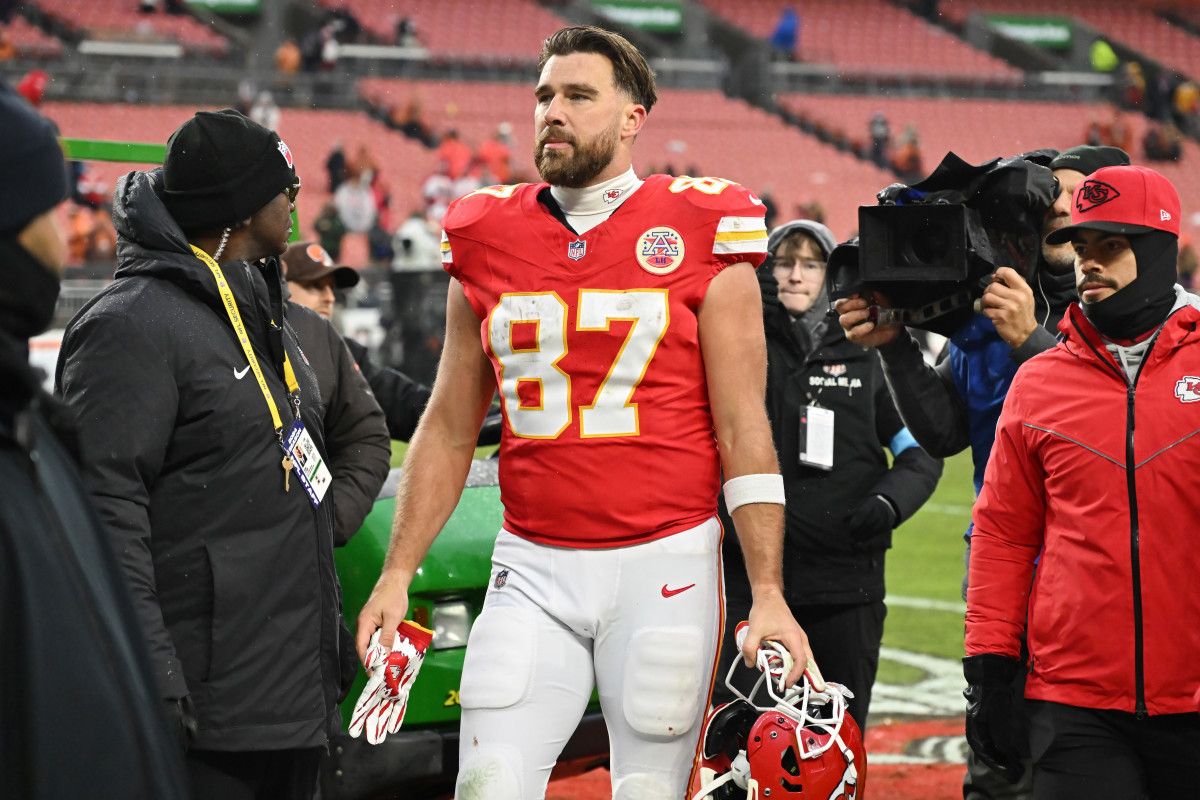 Travis Kelce walks off the field in Cleveland.