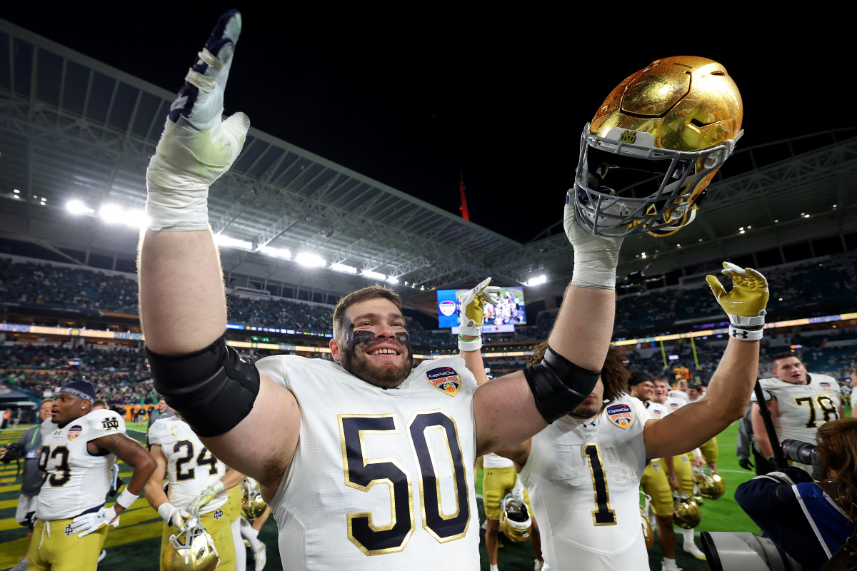 Notre Dame offensive lineman Rocco Spindler celebrates after winning the Orange Bowl.