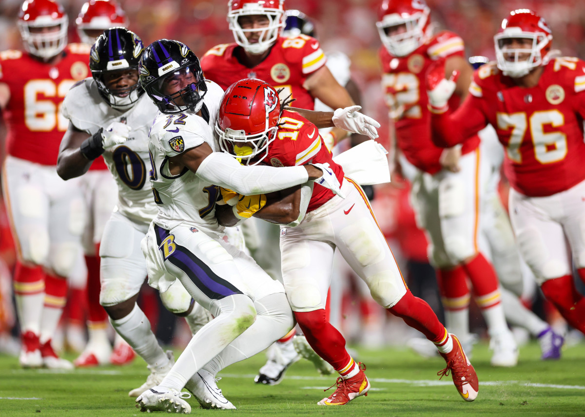 KANSAS CITY, MISSOURI - SEPTEMBER 05: Isiah Pacheco #10 of the Kansas City Chiefs runs the ball against Marcus Williams #32 of the Baltimore Ravens during the third quarter at GEHA Field at Arrowhead Stadium on September 05, 2024 in Kansas City, Missouri. (Photo by Christian Petersen/Getty Images)