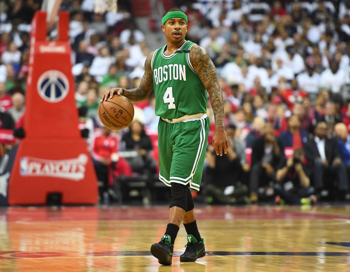 Boston Celtics guard Isaiah Thomas (4) dribbles the ball against the Washington Wizards.