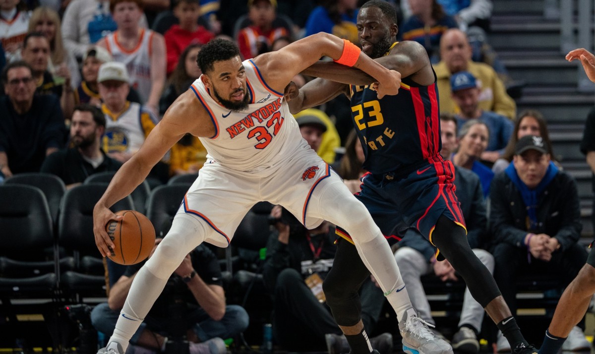 Draymond Green guards Karl-Anthony Towns.