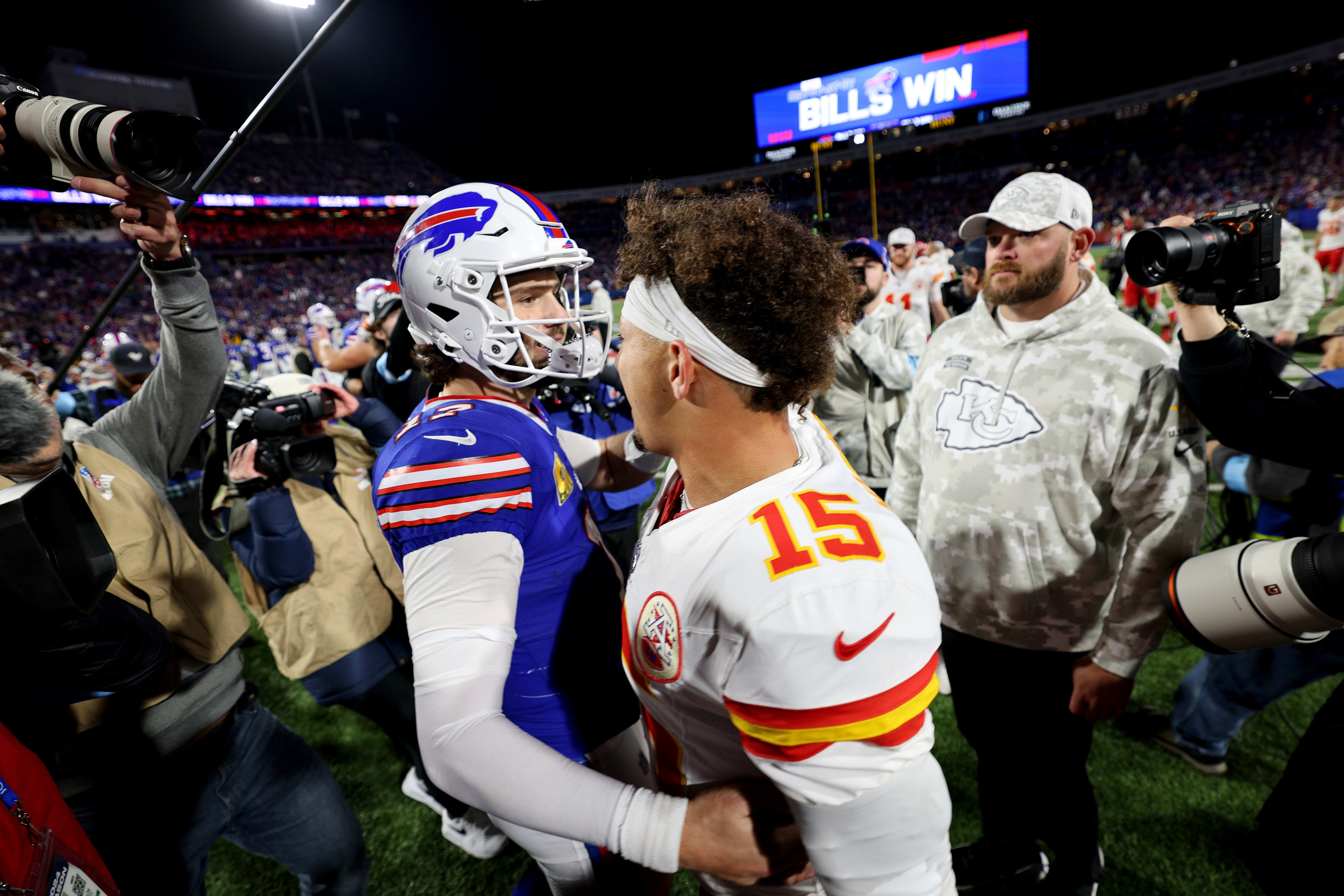 Josh Allen and Patrick Mahomes shake hands.