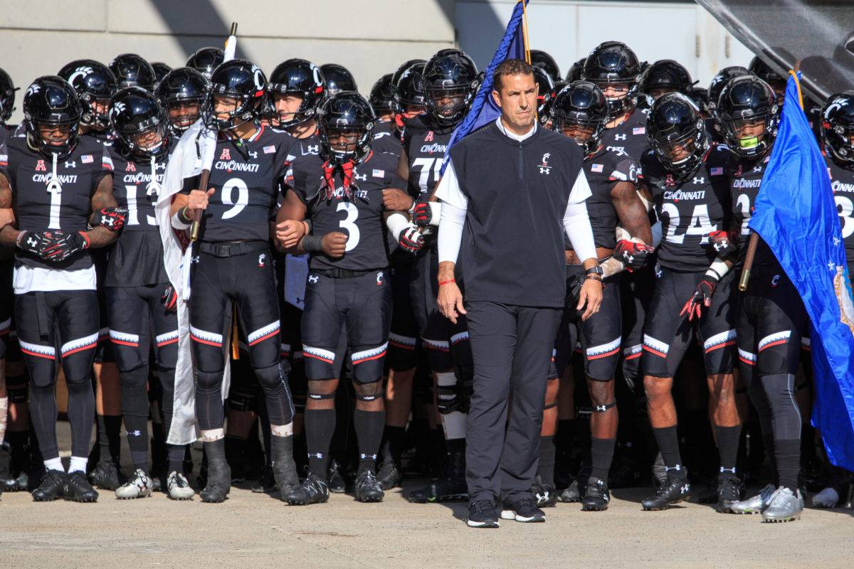 Luke Fickell and the Cincinnati Bearcats prepare to walk out onto the field.