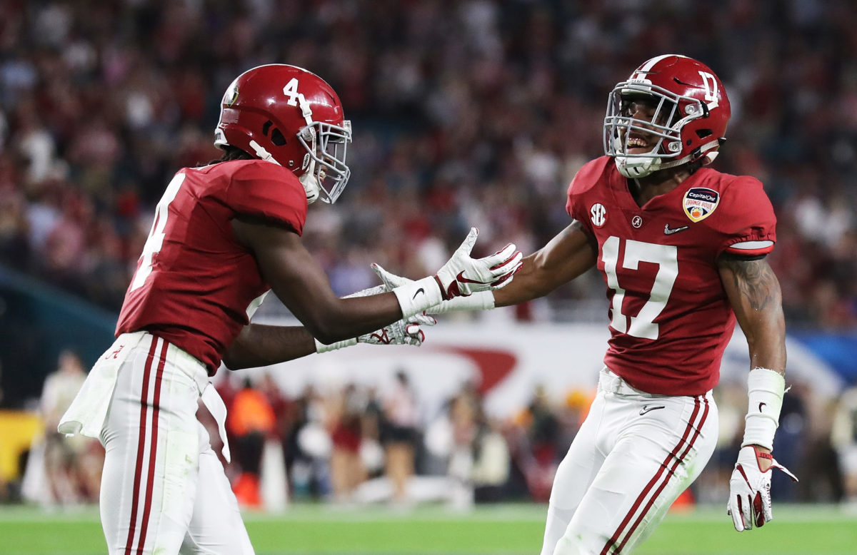 Jaylen Waddle and Jerry Jeudy celebrate a play for Alabama football.