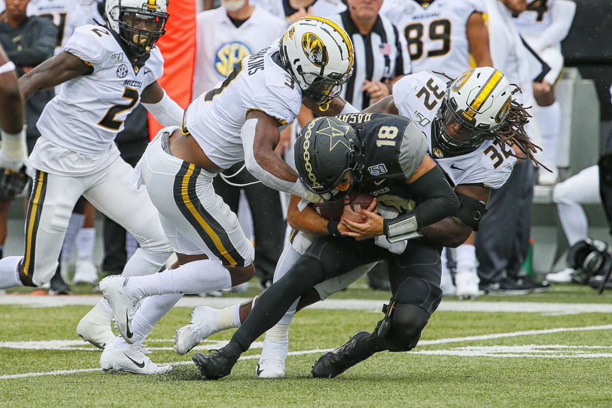 MIssouri linebacker Nick Bolton makes a sack against Vanderbilt.